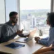 A man and woman meeting in an office for an hr review