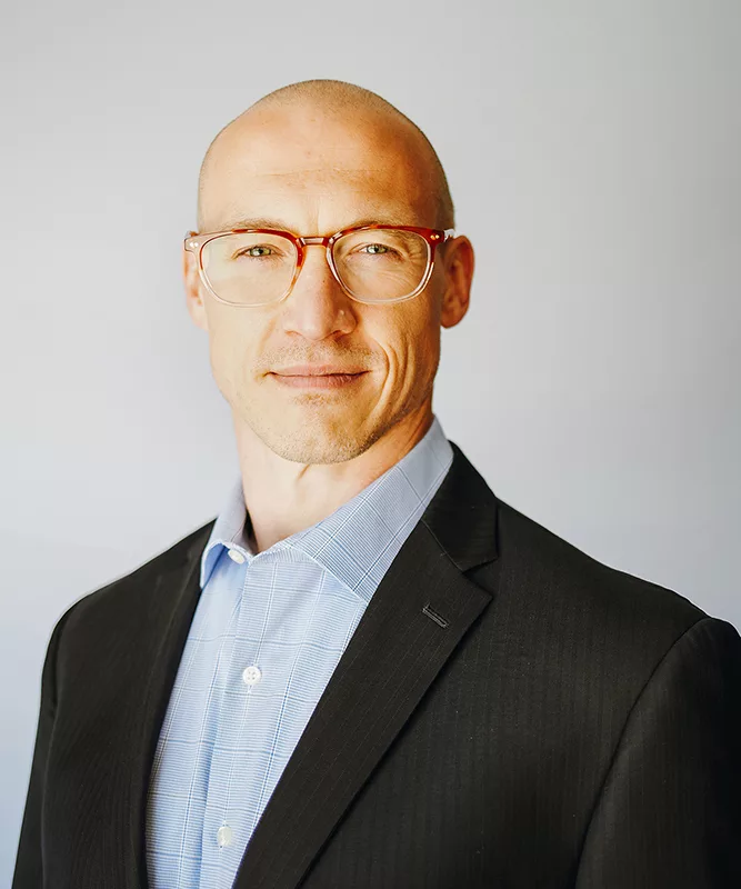 Headshot photograph of Erik Christian, Principal Consultant